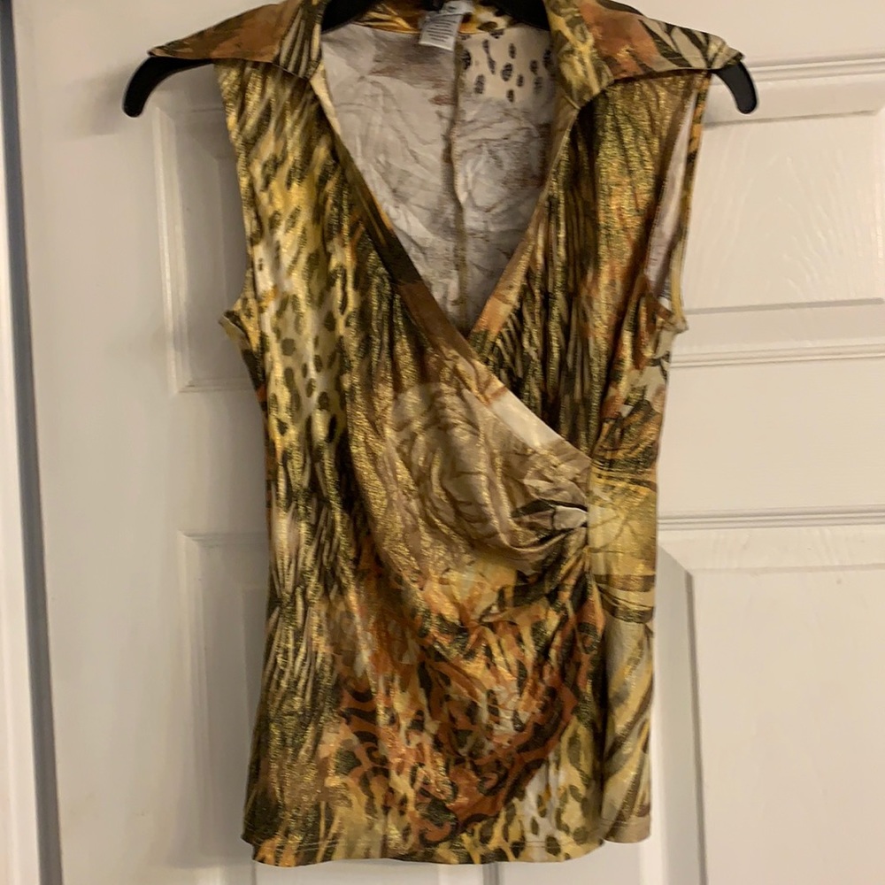 A sleeveless top in earth tones.